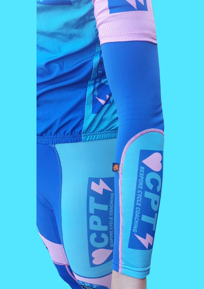 Coach Richard Rollinson wears CPT Cycling arm warmers.
